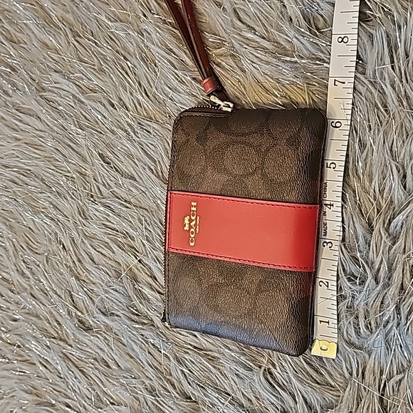 Coach Signature canvas corzip wristlet in gold/walnut/bold red. - Picture 3 of 5